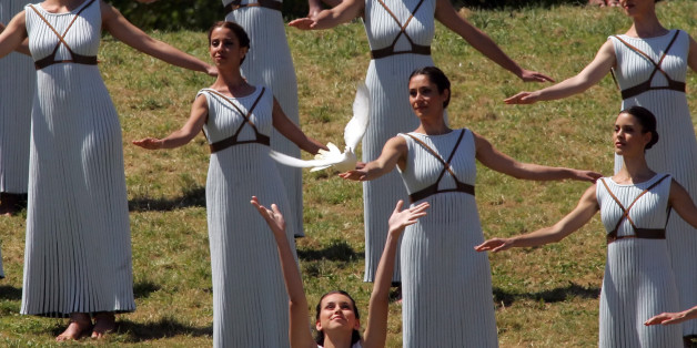 OLYMPIA, GREECE - 21 APRIL: A priestess releases a white dove during the Lighting Ceremony of the Olympic Flame for the Rio Olympic Games on April 21, 2016 in Olympia, Greece. Torchbearers will carry the Olympic Flame from Ancient Olympia on relay through Greece for eight days before a hand-over ceremony at Panathenian Stadium in Athens. (Photo by Milos Bicanski/Getty Images)