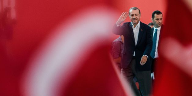 Turkish President Recep Tayyip Erdogan (C) greats supporters on August 7, 2016 in Istanbul during a rally against the failed military coup on July 15. Hundreds of thousands of people gathered in Istanbul for a pro-democracy rally organised by the ruling party, bringing to an end three weeks of demonstrations in support of President Recep Tayyip Erdogan after last month's failed coup. / AFP / OZAN KOSE (Photo credit should read OZAN KOSE/AFP/Getty Images)
