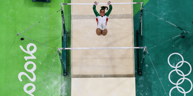 RIO DE JANEIRO, BRAZIL - AUGUST 07: Farah Boufadene of Algeria competes on the uneven bars during Women's qualification for Artistic Gymnastics on Day 2 of the Rio 2016 Olympic Games at the Rio Olympic Arena on August 7, 2016 in Rio de Janeiro, Brazil. (Photo by Ian Walton/Getty Images)