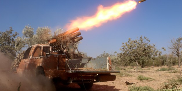ALEPPO, SYRIA - AUGUST 08: Members of the Syrian oppositions launch rocket attack to military headquarters at Assad Regime controlled Hamdaniya district of Aleppo, Syria on August 8, 2016. (Photo by Beha El Halebi/Anadolu Agency/Getty Images)