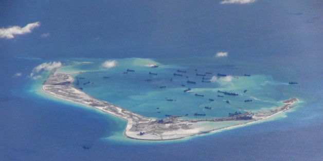 Chinese dredging vessels are purportedly seen in the waters around Mischief Reef in the disputed Spratly Islands in the South China Sea in this still image from video taken by a P-8A Poseidon surveillance aircraft provided by the United States Navy May 21, 2015. U.S. Navy/Handout via Reuters/File Photo ATTENTION EDITORS - THIS PICTURE WAS PROVIDED BY A THIRD PARTY. REUTERS IS UNABLE TO INDEPENDENTLY VERIFY THE AUTHENTICITY, CONTENT, LOCATION OR DATE OF THIS IMAGE. THIS PICTURE IS DISTRIBUTED EXACTLY AS RECEIVED BY REUTERS, AS A SERVICE TO CLIENTS. EDITORIAL USE ONLY. NOT FOR SALE FOR MARKETING OR ADVERTISING CAMPAIGNS FROM THE FILES PACKAGE - SEARCH "SOUTH CHINA SEA FILES" FOR ALL IMAGES