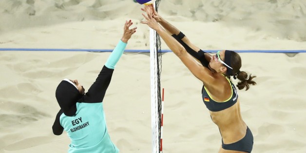 2016 Rio Olympics - Beach Volleyball - Women's Preliminary - Beach Volleyball Arena - Rio de Janeiro, Brazil - 07/08/2016. Doaa Elghobashy (EGY) of Egypt and Kira Walkenhorst (GER) of Germany compete. REUTERS/Lucy Nicholson FOR EDITORIAL USE ONLY. NOT FOR SALE FOR MARKETING OR ADVERTISING CAMPAIGNS.