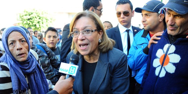 Former chairwomen of the Tunisian magistrates association and candidate for the Tunisian presidential elections Kalthoum Kannou (C) speaks to the press as she campaigns in Ettadhamen city, west of Tunis, on November 19, 2014. Kannou, the only woman in the race, is a magistrate and champion of judicial independence who was a staunch opponent of Ben Ali's regime. AFP PHOTO / MOHAMED KHALIL (Photo credit should read Mohammed Khalil/AFP/Getty Images)