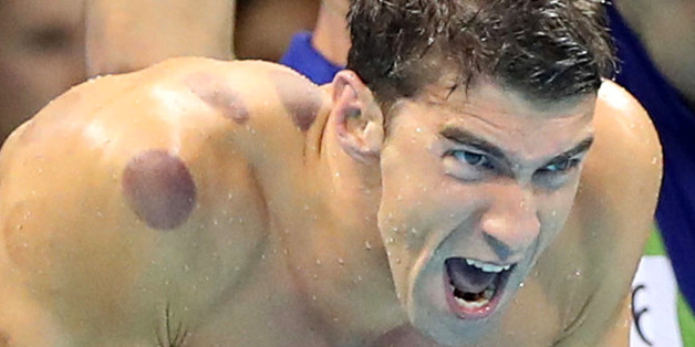 United States' Michael Phelps encourages his teammates in the final of the men's 4x100-meter freestyle relay during the swimming competitions at the 2016 Summer Olympics, Sunday, Aug. 7, 2016, in Rio de Janeiro, Brazil. (AP Photo/Lee Jin-man)