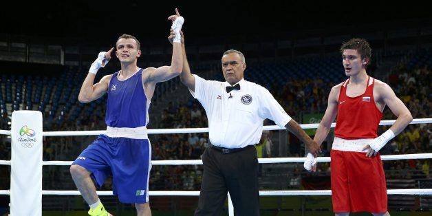 2016 Rio Olympics - Boxing - Preliminary - Men's Light (60kg) Round of 16 Bout 73 - Riocentro - Pavilion 6 - Rio de Janeiro, Brazil - 09/08/2016. Reda Benbaziz (ALG) of Algeria celebrates after winning his bout against Adlan Abdurashidov (RUS) of Russia. REUTERS/Peter Cziborra FOR EDITORIAL USE ONLY. NOT FOR SALE FOR MARKETING OR ADVERTISING CAMPAIGNS.