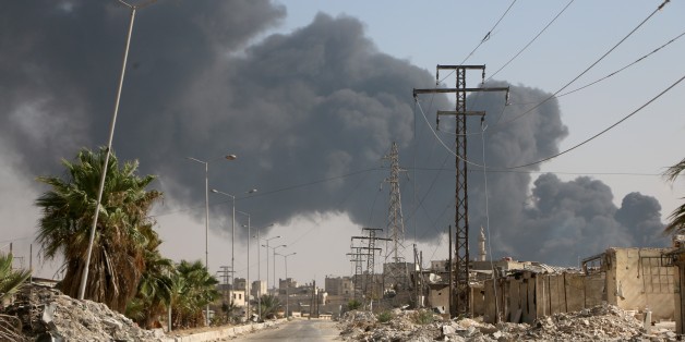 ALEPPO, SYRIA - AUGUST 09: Smoke rises after Russian forces airstrike over opposition controlled cement plant located in southeast of Aleppo, Syria on August 09, 2016. (Photo by Beha El Halebi/Anadolu Agency/Getty Images)