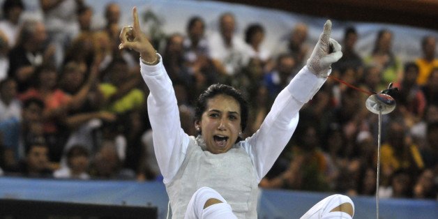 Tunisia's Ines Boubakri celebrates her bronze medal in the women's individual foil event, at the Mediterranean games in Pineto, Italy, Monday, June 29, 2009. (AP Photo/Sandro Perozzi)