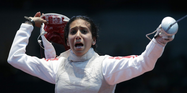 Tunisia's Ines Boubakri celebrates winning against France's Astrid Guyart (not pictured) during their women's Individual Foil round of 16 fencing competition at the ExCel venue at the London 2012 Olympic Games July 28, 2012. REUTERS/Max Rossi (BRITAIN - Tags: SPORT OLYMPICS)