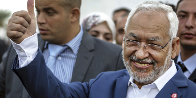 Rachid Ghannouchi, leader of the Tunisian moderate Islamist Ennahda Party, gestures before casting his vote at a polling station in Ben Arous, Tunisia, Sunday Oct. 26, 2014. Tunisians lined up Sunday to choose their first five-year parliament since they overthrew their dictator in the 2011 revolution that kicked off the Arab Spring. (AP Photo/Aimen Zine)