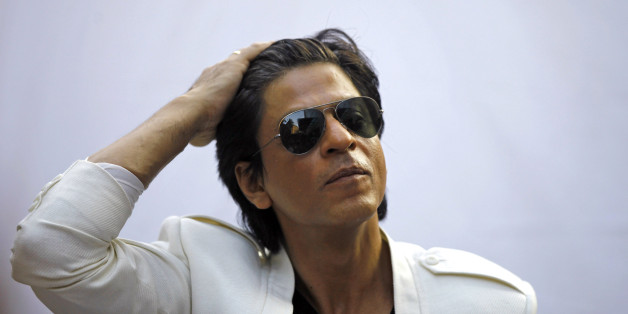 Bollywood superstar Shah Rukh Khan gestures as he speaks to the media outside his home on his birthday in Mumbai, India, Friday, Nov. 2, 2012. (AP Photo/Rafiq Maqbool)