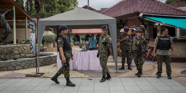 PHUKET, THAILAND - AUGUST 12: Thai security forces stand guard at the scene of a blast near Patong beach on Phuket (847 kilometers south of Bangkok) on August 12, 2016. A series of bomb blasts targeted four cities in southern Thailand overnight as the country prepared to celebrate the birthday of its queen, killing at least three people and injuring around 35. (Photo by Guillaume Payen/Anadolu Agency/Getty Images)
