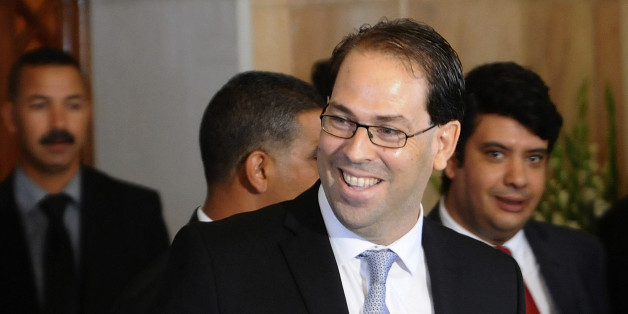 Tunisia's new Prime Minister Youssef Chahed smiles before a press conference at the presidential palace in Tunis, Wednesday, Aug.3, 2016. Chahed served as minister for local affairs in the government that fell over the weekend in a no-confidence vote. The choice of Chahed is controversial in some minds because he is related by marriage to President Beji Caid Essebsi, who nominates the new prime minister. (AP Photo/Hassene Dridi)