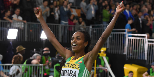 Ethiopia's Genzebe Dibaba celebrates winning the 3000 meters final at the IAAF World Indoor athletic championships in Portland, Oregon on March 20, 2016. / AFP / Mark Ralston (Photo credit should read MARK RALSTON/AFP/Getty Images)