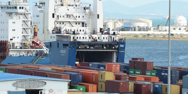 A cargo ship unloads imported goods in the Tunisian port city of Rades on November 12, 2014. The World Bank said in a report published last September that Tunisia's economic model of manufacturing for exports and protecting the domestic market was valid in the 1970s but since then had hindered progress. AFP PHOTO / FETHI BELAID (Photo credit should read FETHI BELAID/AFP/Getty Images)