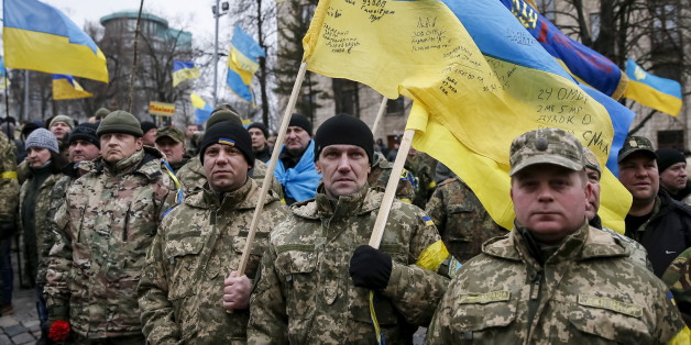 Members of self-defence battalions take part in a rally to commemorate demonstrators who were killed during the Maidan protests in 2014 in Kiev, Ukraine, February 20, 2016. REUTERS/Gleb Garanich TPX IMAGES OF THE DAY