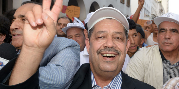 Moroccan politician and the current Istiqlal Party chief Hamid Chabat, who is also the mayor of Fez, flashes the sign for victory during a demonstration against the Islamist government and the high cost of living after price rises of staple goods on September 22, 2013 in the Moroccan capital, Rabat. Up to 5,000 people took part in the protest after a call by the UGTM trade union which is close to the nationalist Istiqlal party. AFP PHOTO / FADEL SENNA (Photo credit should read FADEL SENNA