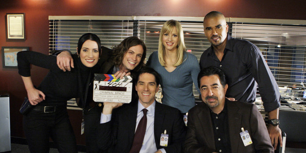 LOS ANGELES - JANUARY 25: 'Mosley Lane' -Behind the scenes with series stars (LtoR) Paget Brewset, Matthew Gray Gubler, Thomas Gibson (seated), A.J. Cook, Shemar Moore, and Joe Mantegna (seated) of the CBS drama CRIMINAL MINDS. Gubler directed this episode which will air Wednesday, March 3 (9:00-10:00 PM, ET/PT) on the CBS Television Network. (Photo by Cliff Lipson/CBS via Getty Images) *** local caption ***