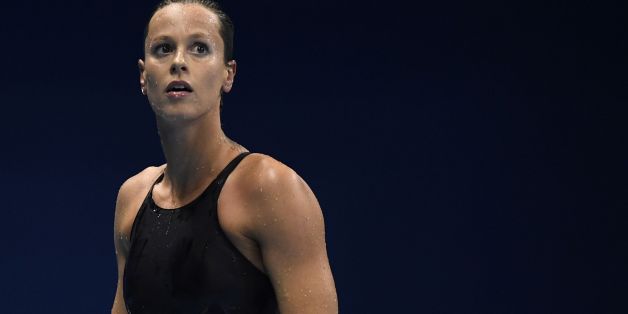 Italy's Federica Pellegrini looks at the results board after competing in the Women's 200m Freestyle semifinal during the swimming event at the Rio 2016 Olympic Games at the Olympic Aquatics Stadium in Rio de Janeiro on August 8, 2016. / AFP / CHRISTOPHE SIMON (Photo credit should read CHRISTOPHE SIMON/AFP/Getty Images)