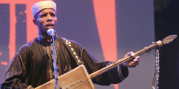 A member of Diwan El Waha of Bechar performs during the Alger Festival Gnaoui in Algiers July 6, 2008. REUTERS/Louafi Larbi (ALGERIA)