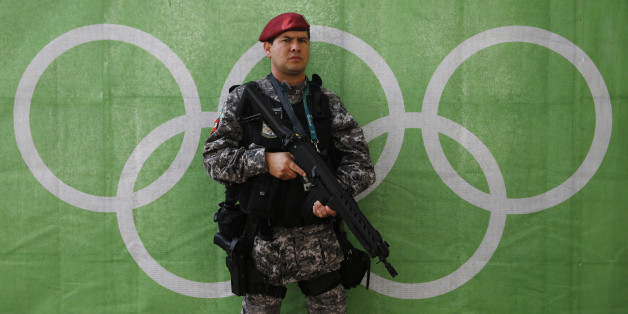 2016 Rio Olympics - Lagoa - 30/07/2016. A police officer stands at the Olympic rowing venue. REUTERS/Stefan Wermuth TPX IMAGES OF THE DAY
