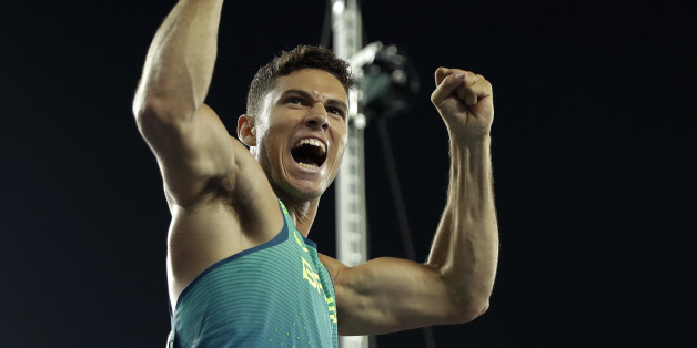 Brazil's Thiago Da Silva celebrates after setting a new Olympic record to win the gold medal in the men's pole vault final during the athletics competitions of the 2016 Summer Olympics at the Olympic stadium in Rio de Janeiro, Brazil, Monday, Aug. 15, 2016. (AP Photo/Matt Slocum)