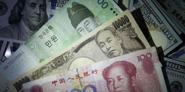 South Korean won, Chinese yuan and Japanese yen notes are seen on U.S. 100 dollar notes in this picture illustration December 15, 2015. REUTERS/Kim Hong-Ji//Illustration/File photo
