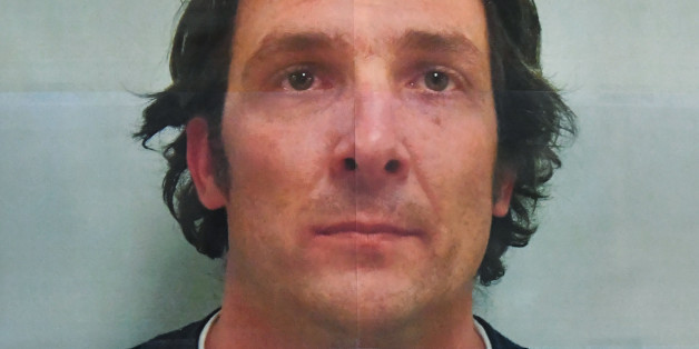 Damin Pashilk, seen here in a poster on display at a press briefing at Twin Pines Casino in Middletown, Calif., was arrested Monday on arson charges for allegedly sparking a wildfire that exploded over the weekend in the Northern California town of Lower Lake, Monday, Aug. 15, 2016. Lake County Sheriff Brian Martin said Damin Anthony Pashilk, 40, of Clearlake was arrested Monday on 17 counts of arson and is in jail. He is suspected in numerous fires in Lake County over the past year. (AP Photo/