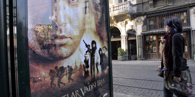 Istanbul, TURKEY: TO GO WITH STORY FILES - A girl walks past a billboard showing the poster of the new Turkish movie 'Valley of the Wolves' ('Kurtlar vadisi'), 03 February 2006 in downtown Istanbul. The movie is very successful in the Turkish community in Germany, whereas some German politicians have suggested that the film could further fuel the tension between the West and the Islamic world sparked by the publication of cartoons of the Prophet Mohammed in European media. AFP PHOTO/MUSTAFA