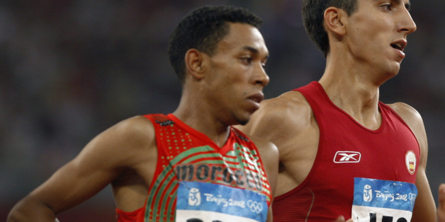 Abdalaati Iguider (L) of Morocco and Arturo Casado of Spain run during their men's 1500m heat in the athletics competition in the National Stadium at the Beijing 2008 Olympic Games August 15, 2008. REUTERS/Gary Hershorn (CHINA)