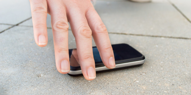 lucky man finding a phone on the street