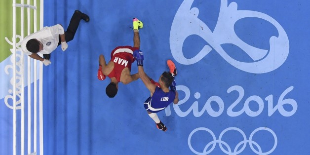 2016 Rio Olympics - Boxing - Preliminary - Men's Bantam (56kg) Round of 16 Bout 192 - Riocentro - Pavilion 6 - Rio de Janeiro, Brazil - 14/08/2016. Mohamed Hamout (MAR) of Morocco and Robeisy Eloy Ramirez Carrazana (CUB) of Cuba compete. REUTERS/Pool FOR EDITORIAL USE ONLY. NOT FOR SALE FOR MARKETING OR ADVERTISING CAMPAIGNS.