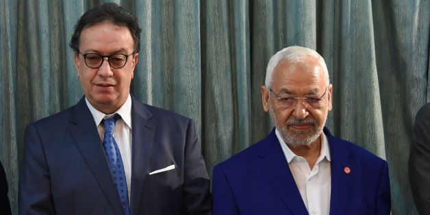 Rached Ghannouchi,Tunisian Islamist Ennahdha Party leader(R)Hafedh Caid Essebsi, leader of Nidaa Tounes party(C) and Slim Riahi, leader of the Free Patriotic Union (UPL)(L)pose for photographers at Carthage Palace in Carthage, some 15 kilometres on the outskirts of Tunis, on August 3, 2016, prior to the appointment of a new prime minister by Tunisia's president.
Essebsi named local affairs minister Youssef Chahed, 40, as prime minister-designate tasked with forming a unity cabinet to tackle major economic and security challenges.
/ AFP / FETHI BELAID (Photo credit should read FETHI BELAID/AFP/Getty Images)