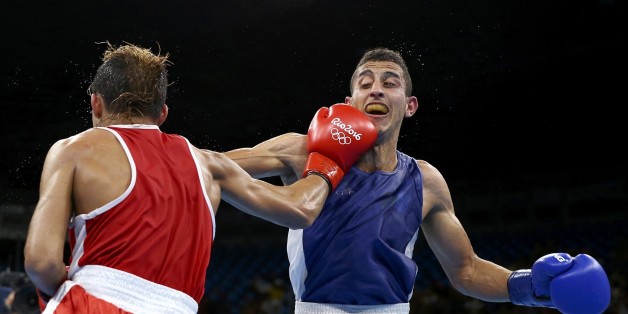 2016 Rio Olympics - Boxing - Quarterfinal - Men's Fly (52kg) Quarterfinals Bout 247 - Riocentro - Pavilion 6 - Rio de Janeiro, Brazil - 17/08/2016. Yoel Finol (VEN) of Venezuela and Mohamed Flissi (ALG) of Algeria compete. REUTERS/Peter Cziborra FOR EDITORIAL USE ONLY. NOT FOR SALE FOR MARKETING OR ADVERTISING CAMPAIGNS.