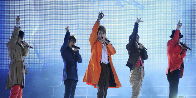 Members of Japanese pop music group SMAP (from L) Goro Inagaki, Takuya Kimura, Shingo Katori, Tsuyoshi Kusanagi, Masahiro Nakai perform during their concert in Beijing, September 16, 2011. China has warmly welcomed Japanese pop group SMAP ahead of a concert in Beijing on Friday, whose theme is "Do Your Best Japan, Thank You China, Asia is One" in gratitude for Chinese help after Japan's March tsunami disaster. Picture taken September 16, 2011. REUTERS/China Daily (CHINA - Tags: SOCIETY ENTERTAIN