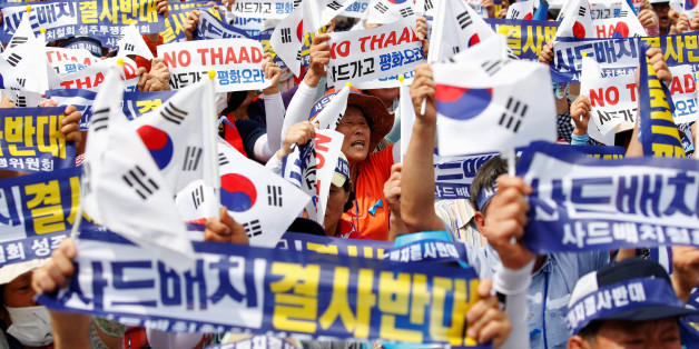 Seoungju residents chant slogans during a protest against the government's decision on deploying a U.S. THAAD anti-missile defense unit in Seongju, in Seoul, South Korea, July 21, 2016. The banner reads "Desperately oppose deploying THAAD". REUTERS/Kim Hong-Ji