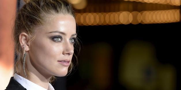 Cast member Amber Heard poses during the premiere of the film "The Danish Girl" in Los Angeles, California November 21, 2015. The film opens in the U.S. on November 27. REUTERS/Kevork Djansezian