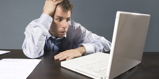 Caucasian business man sweating at desk