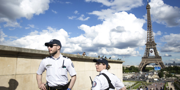 French police officers patrol at Trocadero Plaza next to the Eiffel Tower in Paris, Wednesday, June 15, 2016. French authorities are on especially high alert around the European Championship soccer tournament taking place across the country through July 10. (AP Photo/Kamil Zihnioglu)