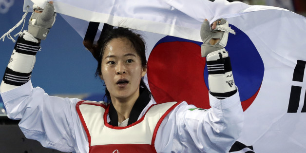 Oh Hyeri of South Korea celebrates after winning a women's Taekwondo 67-kg final at the 2016 Summer Olympics in Rio de Janeiro, Brazil, Friday, Aug. 19, 2016. (AP Photo/Andrew Medichini)