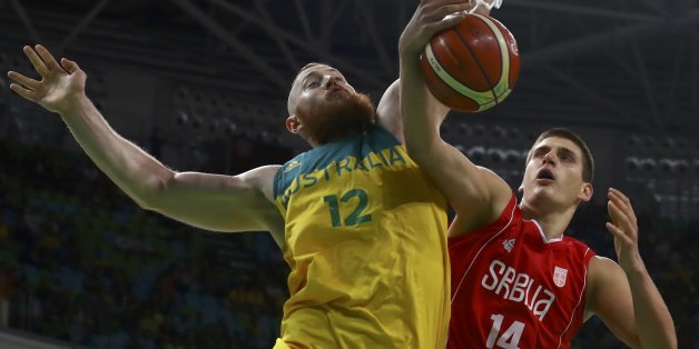 2016 Rio Olympics - Basketball - Semifinal - Men's Semifinal Australia v Serbia - Carioca Arena 1 - Rio de Janeiro, Brazil - 19/8/2016. Nikola Jokic (SRB) of Serbia and Aron Baynes (AUS) of Australia in action. REUTERS/Jim Young FOR EDITORIAL USE ONLY. NOT FOR SALE FOR MARKETING OR ADVERTISING CAMPAIGNS.