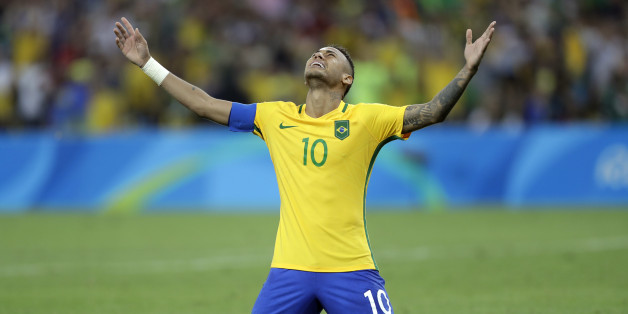 Brazil's Neymar cries as he kneels down to celebrate after scoring the decisive penalty kick during the final match of the men's Olympic football tournament between Brazil and Germany at the Maracana stadium in Rio de Janeiro, Brazil, Saturday Aug. 20, 2016. Brazil won the gold medal on a penalty shootout. (AP Photo/Andre Penner)
