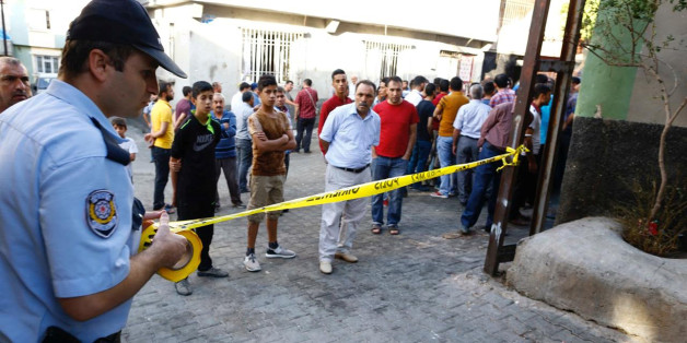 A police officer secures the scene of an explosion where a suspected suicide bomber targeted a wedding celebration in the Turkish city of Gaziantep, Turkey, August 21, 2016. REUTERS/Osman Orsal