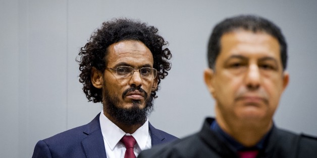 Alleged Al-Qaeda-linked Islamist leader Ahmad Faqi Al Mahdi looks on in the courtroom of the International Criminal Court (ICC) on September 30, 2015, in The Hague. Ahmad Al Faqi Al Mahdi was transferred to the ICC on September, 26 2015 following an arrest warrant issued by the Court on September, 18 2015 facing charges of ordering the destruction of monuments in Mali's fabled city of Timbuktu. AFP PHOTO / ANP POOL / ROBIN VAN LONKHUIJSEM ==NETHERLANDS OUT== (Photo credit should read RO