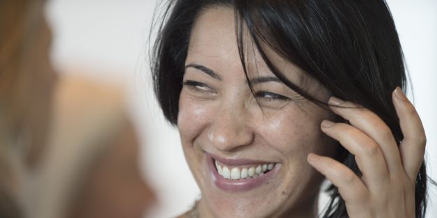 Founder and President of Aswat Nisaa (Women's Voice) of Tunisia Ikram Ben Said, smiles after being awarded the 2014 Madeleine K. Albright Grant from the National Democratic Institute in Washington, DC, May 19, 2014. AFP PHOTO / Jim WATSON (Photo credit should read JIM WATSON/AFP/Getty Images)