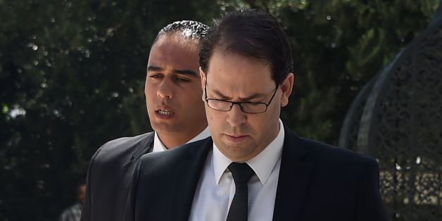Tunisia's premier-designate Youssef Chahed arrives to give a press conference to present his proposed new unity government list after he submitted it to the president on August 20, 2016 in Carthage, near the capital Tunis.
Chahed, a 40-year-old former local affairs minister and member of the Nidaa Tounes party, had been given 30 days to form a cabinet. If his cabinet wins the backing of parliament, Chahed will become the North African country's youngest premier since independence from France in 1956.
/ AFP / FETHI BELAID (Photo credit should read FETHI BELAID/AFP/Getty Images)