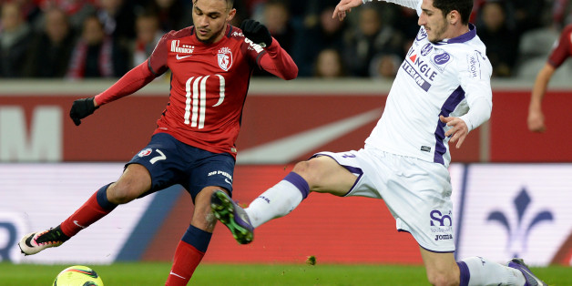 Lille's French midfielder Sofiane Boufal (L) challenges Toulouse's French midfielder Yann Bodiger during the French L1 football match between Lille and Toulouse at the Grand Stade Pierre Mauroy Stadium in Villeneuve d'Ascq on March 19, 2016. AFP PHOTO / DENIS CHARLET / AFP / DENIS CHARLET (Photo credit should read DENIS CHARLET/AFP/Getty Images)