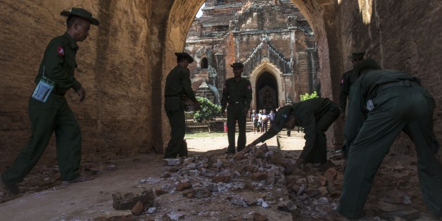 BAGAN, MYANMAR - AUGUST 25 : Myanmar military staff and a police officer collect the pieces of bricks of Dhammayangyi temple after earthquake in ancient Bagan city, Myanmar on August 25, 2016. The magnitude 6.8 earthquake that rocked central Myanmar has left at least four people dead and more than 200 ancient temples and pagodas damaged, government officials said Thursday. (Photo by Kyaw Kyaw/Anadolu Agency/Getty Images)