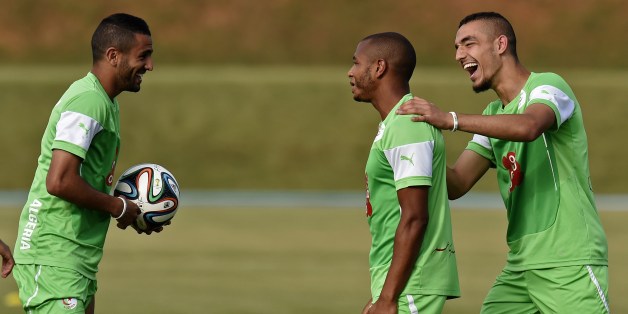 Algeria's midfielder Nabil Bentaleb (R), midfielder Yacine Brahimi (C) and forward Riyad Mahrez (L) joke during a training session at the Atletico World Sports Center in Sorocaba, Brazil on June 14, 2014, during the 2014 FIFA World Cup. AFP PHOTO / PHILIPPE DESMAZES (Photo credit should read PHILIPPE DESMAZES/AFP/Getty Images)