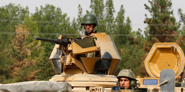 Turkish soldiers on an armoured vehicle are seen in Karkamis on the Turkish-Syrian border in the southeastern Gaziantep province, Turkey, August 25, 2016. REUTERS/Umit Bektas