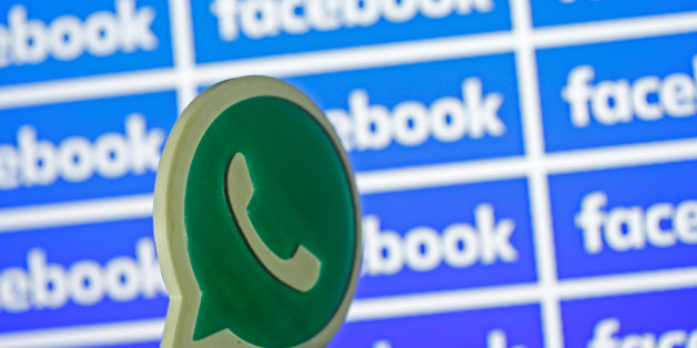 A 3D printed Whatsapp logo is seen in front of a displayed Facebook logo in this illustration taken April 28, 2016. REUTERS/Dado Ruvic/Illustration